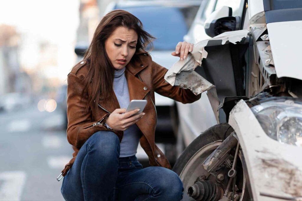 A woman calling her car accident lawyer after having an auto accident