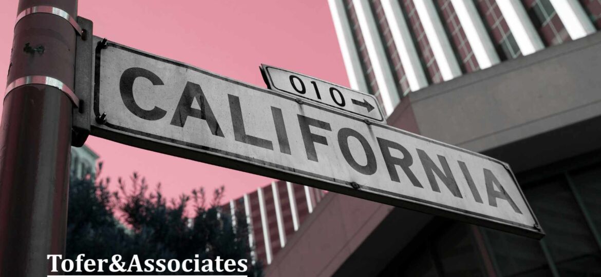 A sign in a California's street with the Tofer & Associates logo