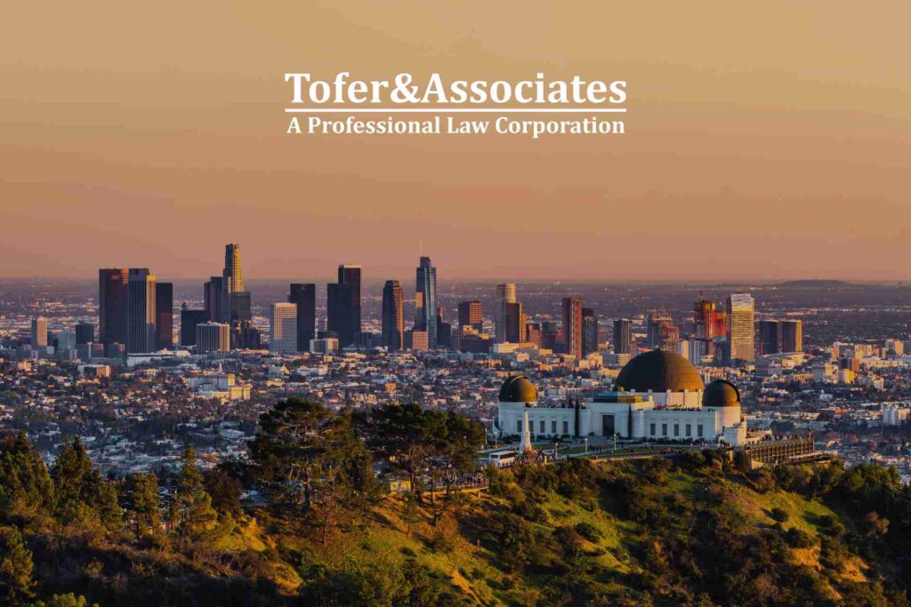 Sunset Los Angeles California, with the Tofer & Associates logo over it.