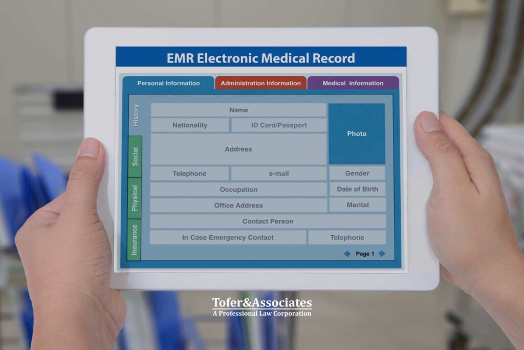 A person holding a tablet with an electronic medical record